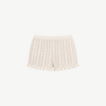 KABE SHOP INC Christine high-waisted knit shorts in cream with a delicate pointelle pattern and ruffled hem detail.