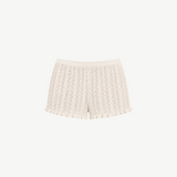 KABE SHOP INC Christine high-waisted knit shorts in cream with a delicate pointelle pattern and ruffled hem detail.