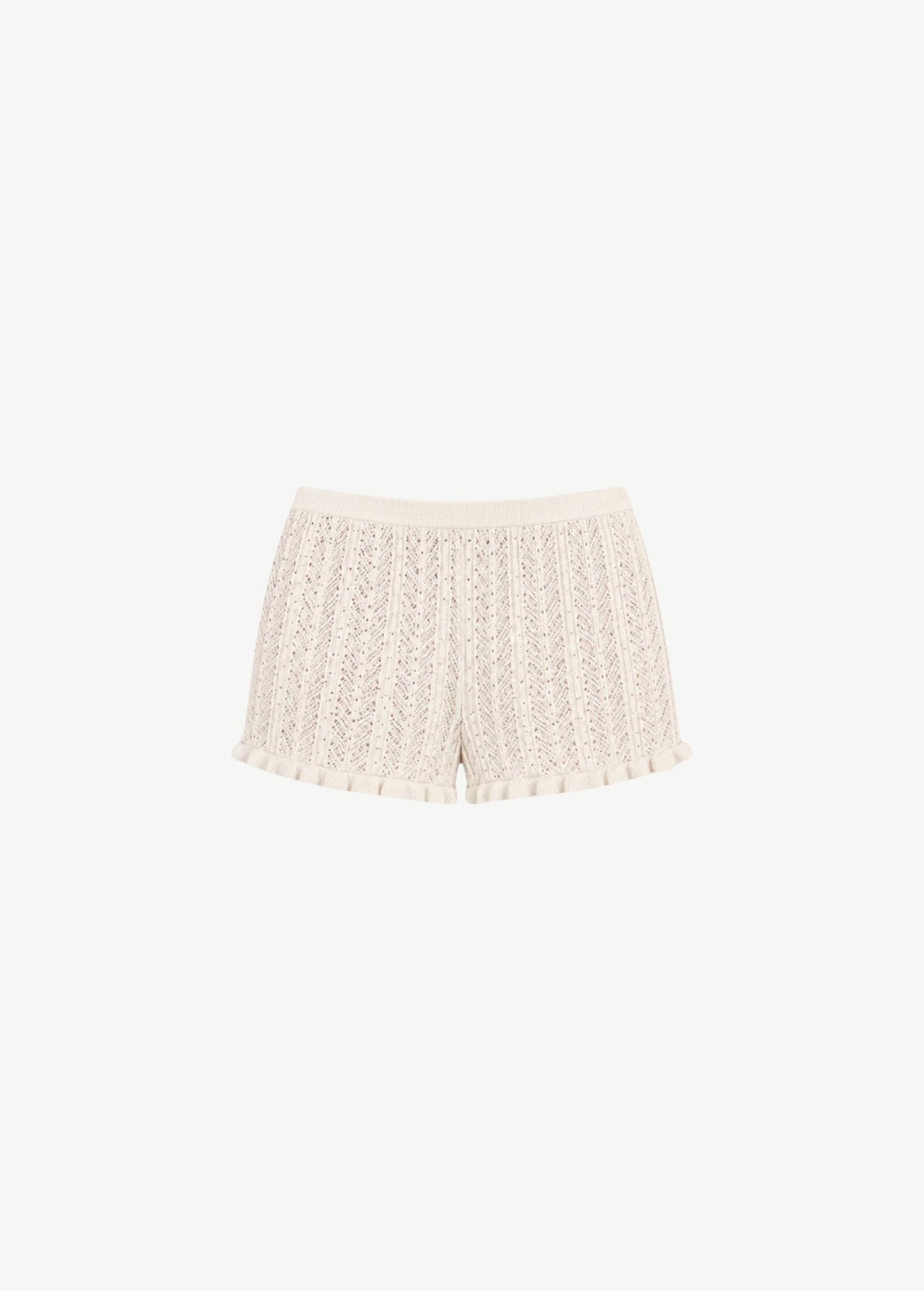 KABE SHOP INC Christine high-waisted knit shorts in cream with a delicate pointelle pattern and ruffled hem detail.