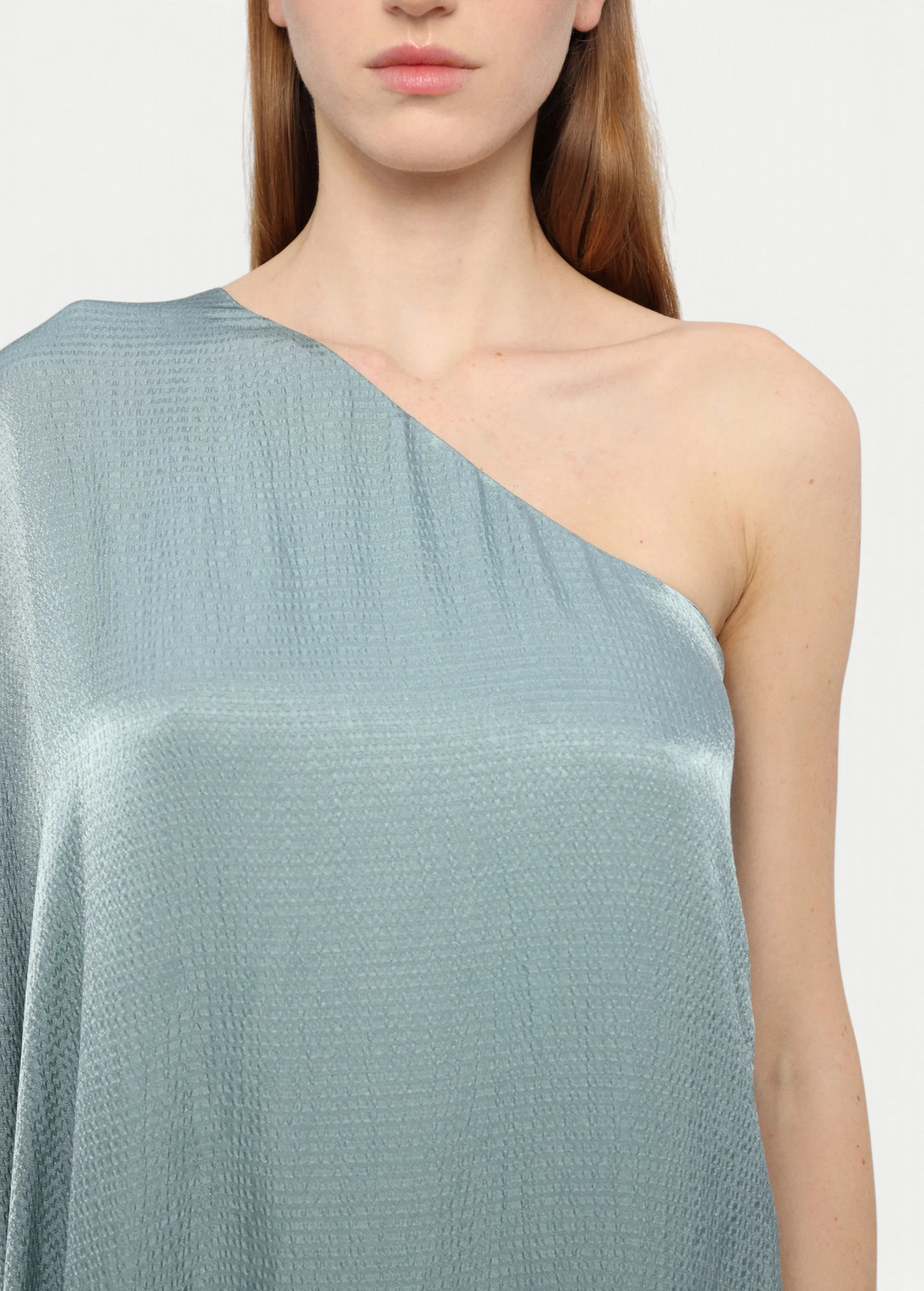 KABE SHOP INC Sonia one-shoulder maxi dress in a shimmering sage green textured fabric on a model