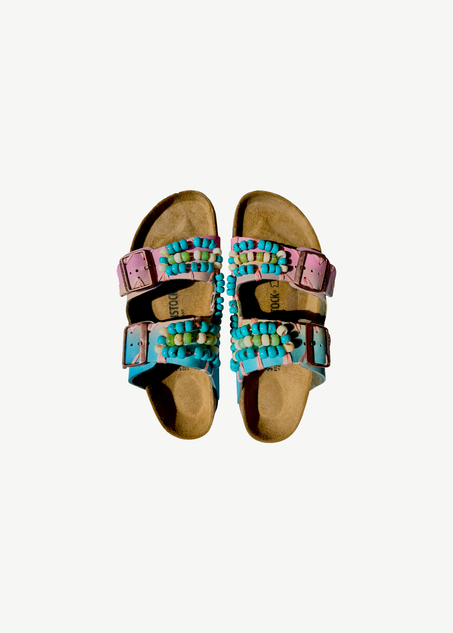 KABE SHOP INC hand-painted Birkenstocks with blue and pink leather straps, featuring artisanal beaded embroidery.