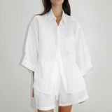 Model wearing KABE SHOP INC 03 Set, a white oversized French linen shirt and matching loose boxer-style shorts.