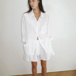Model wearing KABE SHOP INC 03 Set, a white oversized French linen shirt and matching loose boxer-style shorts.