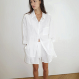 Model wearing KABE SHOP INC 03 Set, a white oversized French linen shirt and matching loose boxer-style shorts.