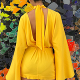 KABE SHOP INC Mini Florida dress in bright yellow with long bell sleeves and a large back bow, back view