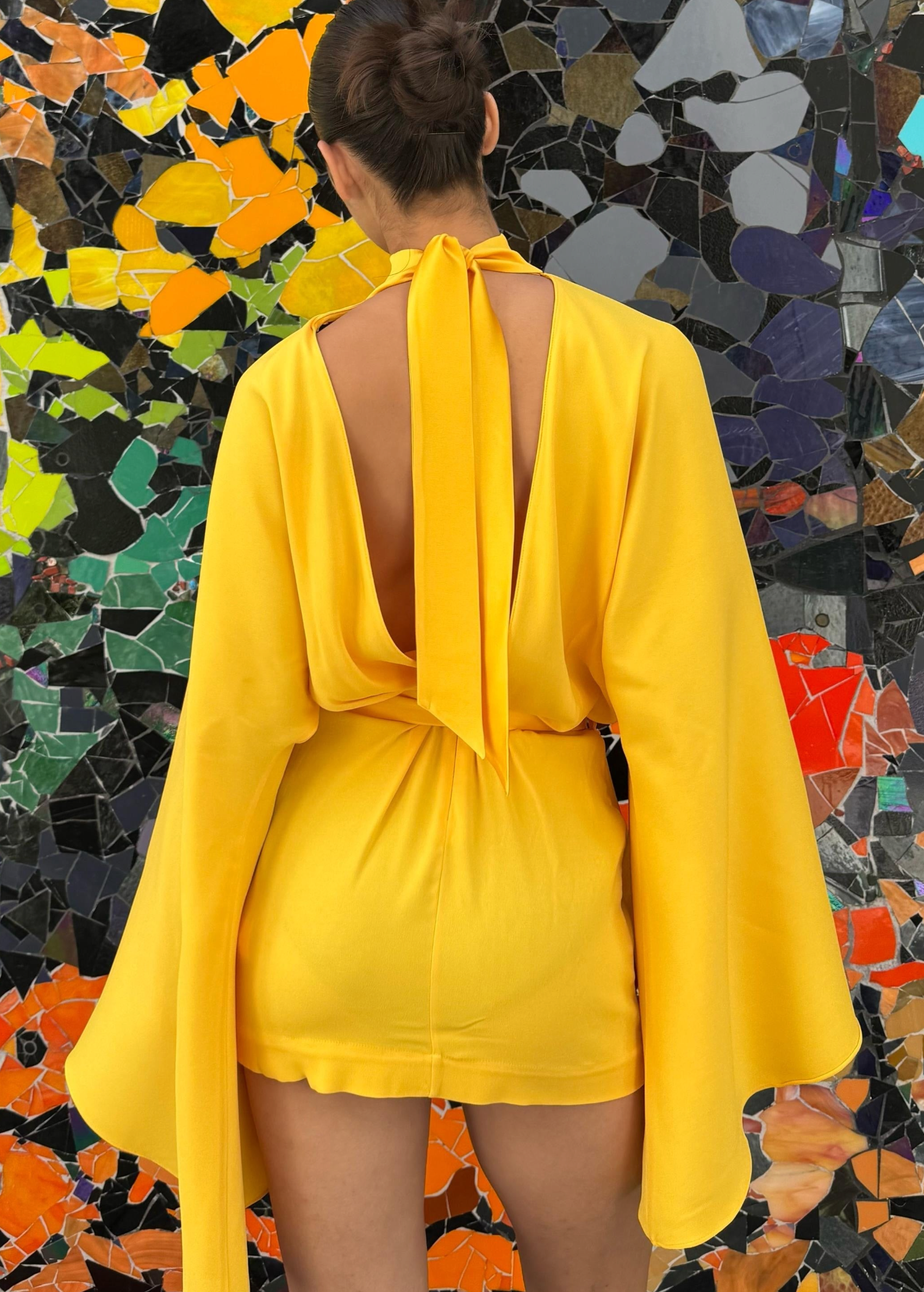 KABE SHOP INC Mini Florida dress in bright yellow with long bell sleeves and a large back bow, back view
