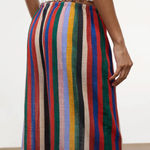 Wide-leg Mateo Pant with a colorful vertical stripe pattern and an elastic waistband, worn with a white ribbed top as a relaxed, warm-weather essential.
