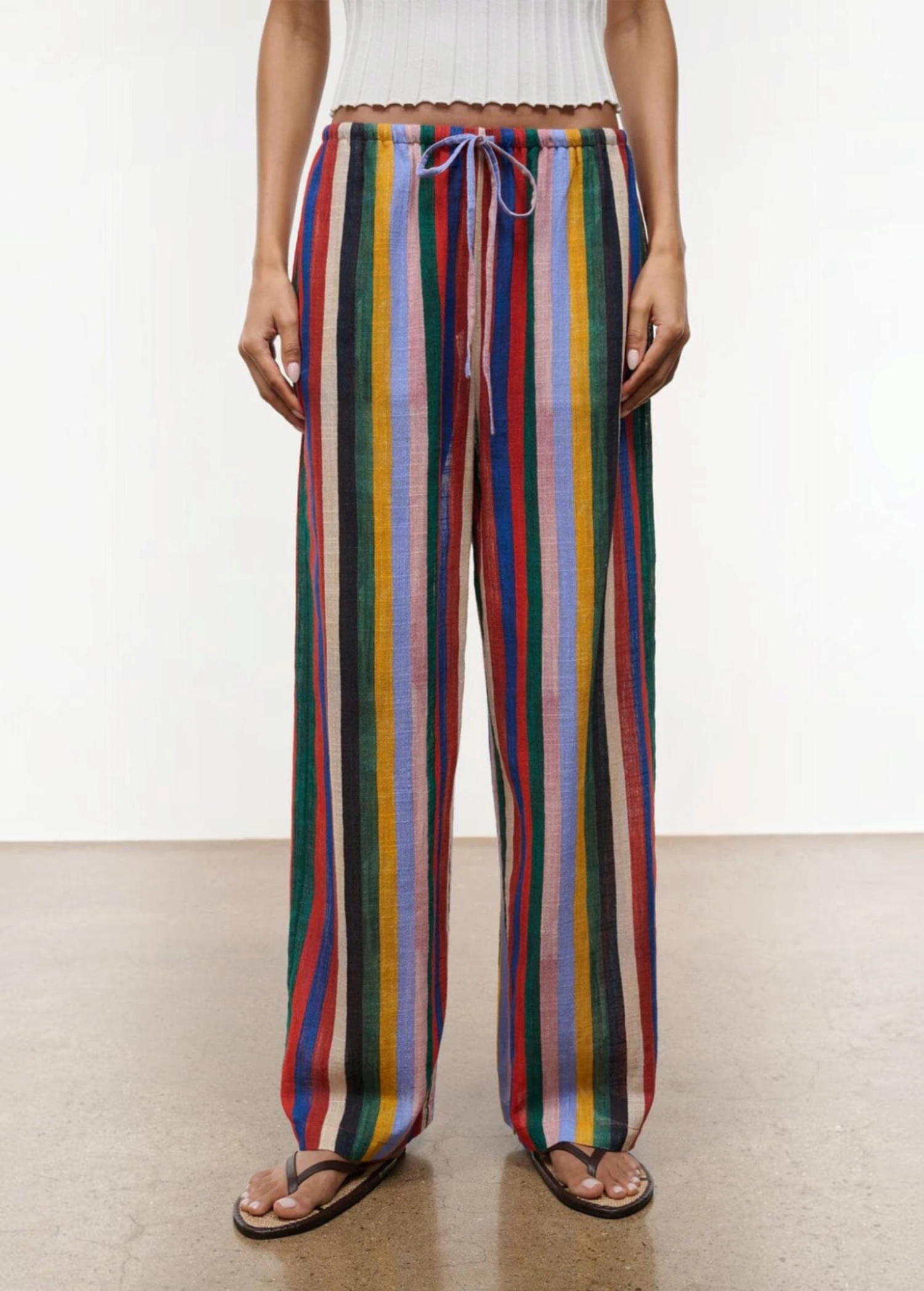 Relaxed wide-leg Mateo Pant featuring a multicolored vertical stripe pattern and a drawstring waist.