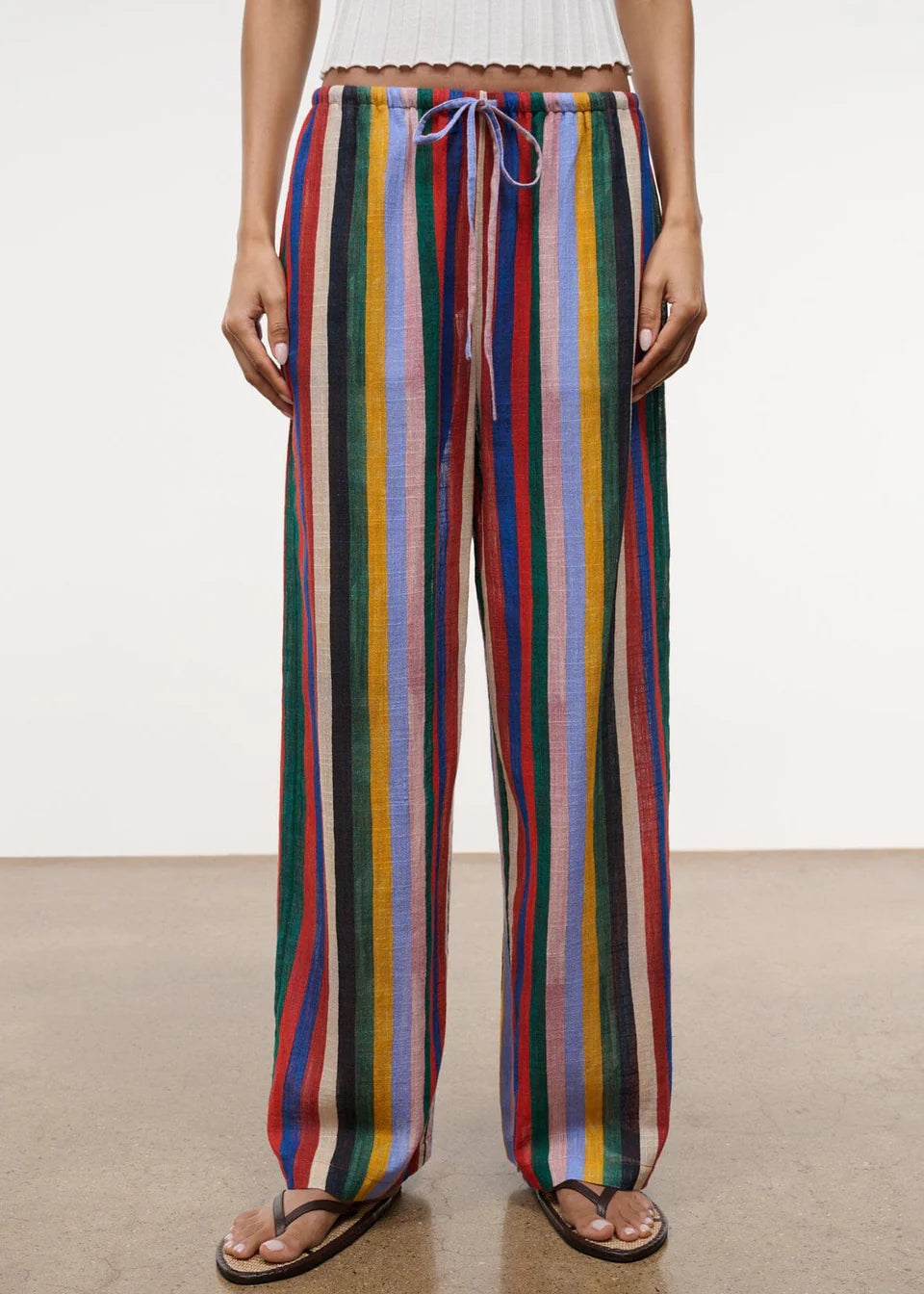 Relaxed wide-leg Mateo Pant featuring a multicolored vertical stripe pattern and a drawstring waist.