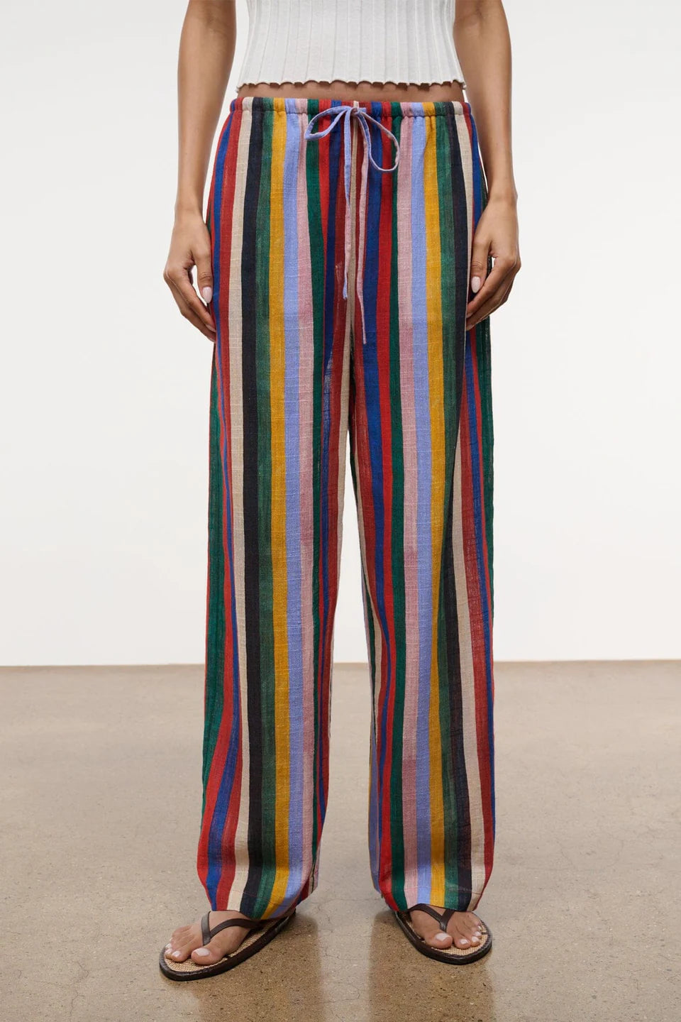 Relaxed wide-leg Mateo Pant featuring a multicolored vertical stripe pattern and a drawstring waist.