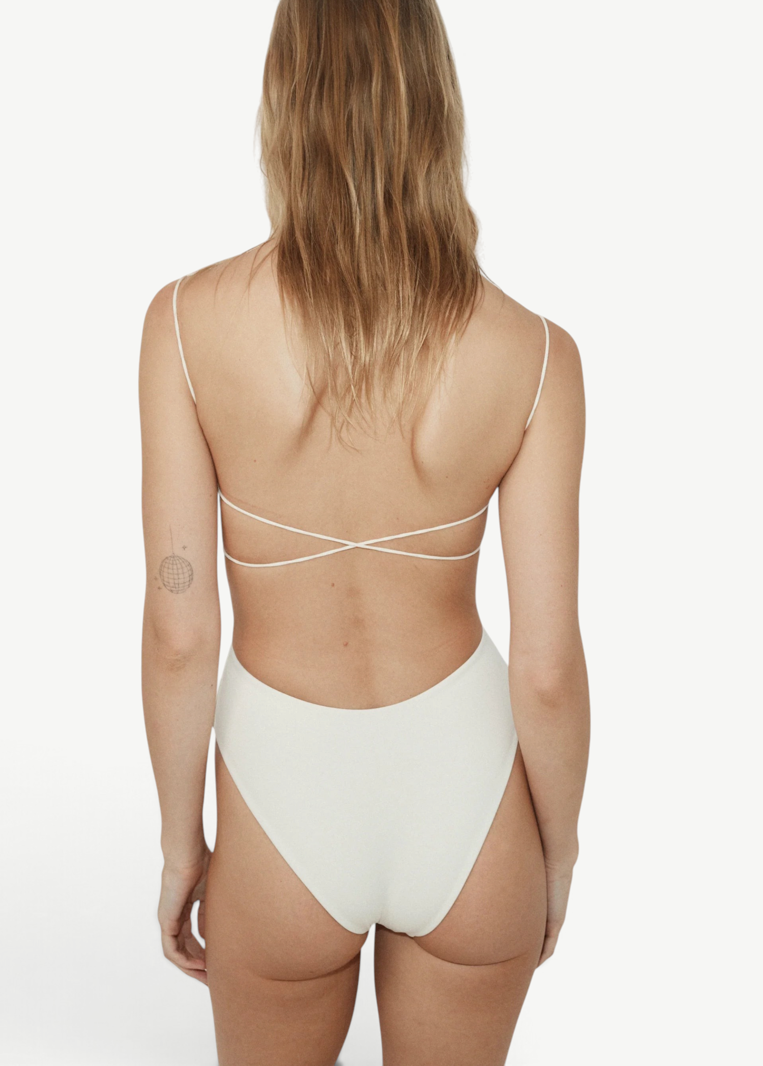 KABE SHOP INC Fine Strap One Piece in white with an open back, delicate elasticated straps, and high-cut legs.