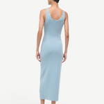 Back view of the Neva Dress, a sophisticated, light blue ribbed midi dress with circular button details along the back neckline for a timeless style.