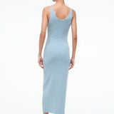 Back view of the Neva Dress, a sophisticated, light blue ribbed midi dress with circular button details along the back neckline for a timeless style.