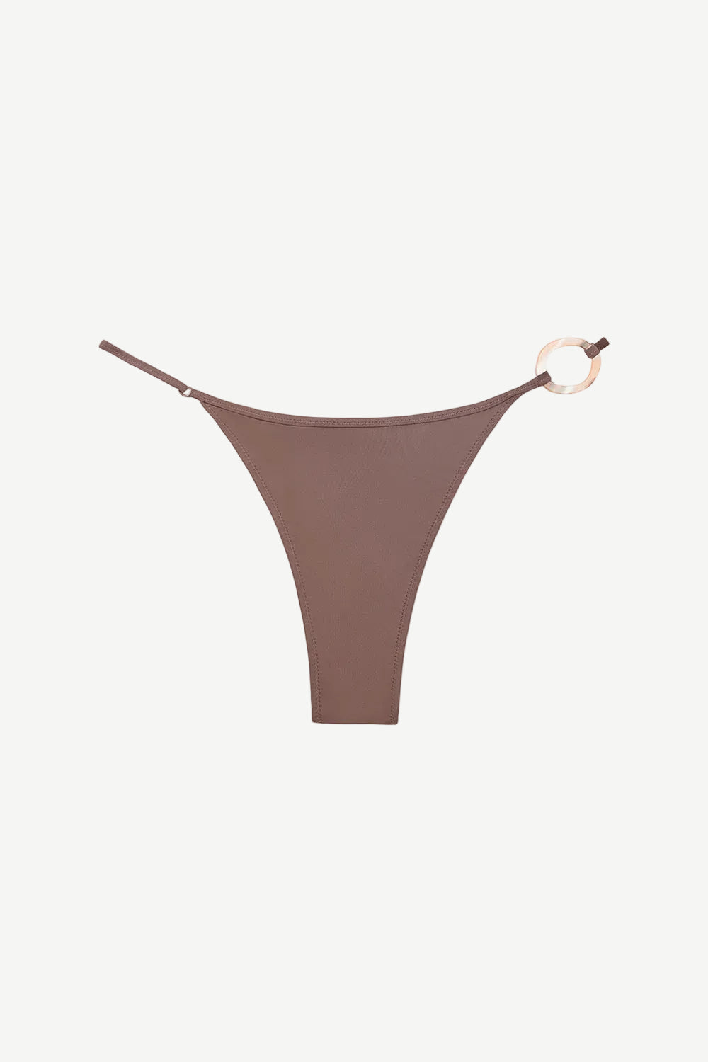 The Orb Luna Bottom is a brown high-cut bikini bottom crafted from ECONYL® regenerated nylon, featuring thin adjustable straps and a decorative gold ring detail on the right side, displayed on a white background.
