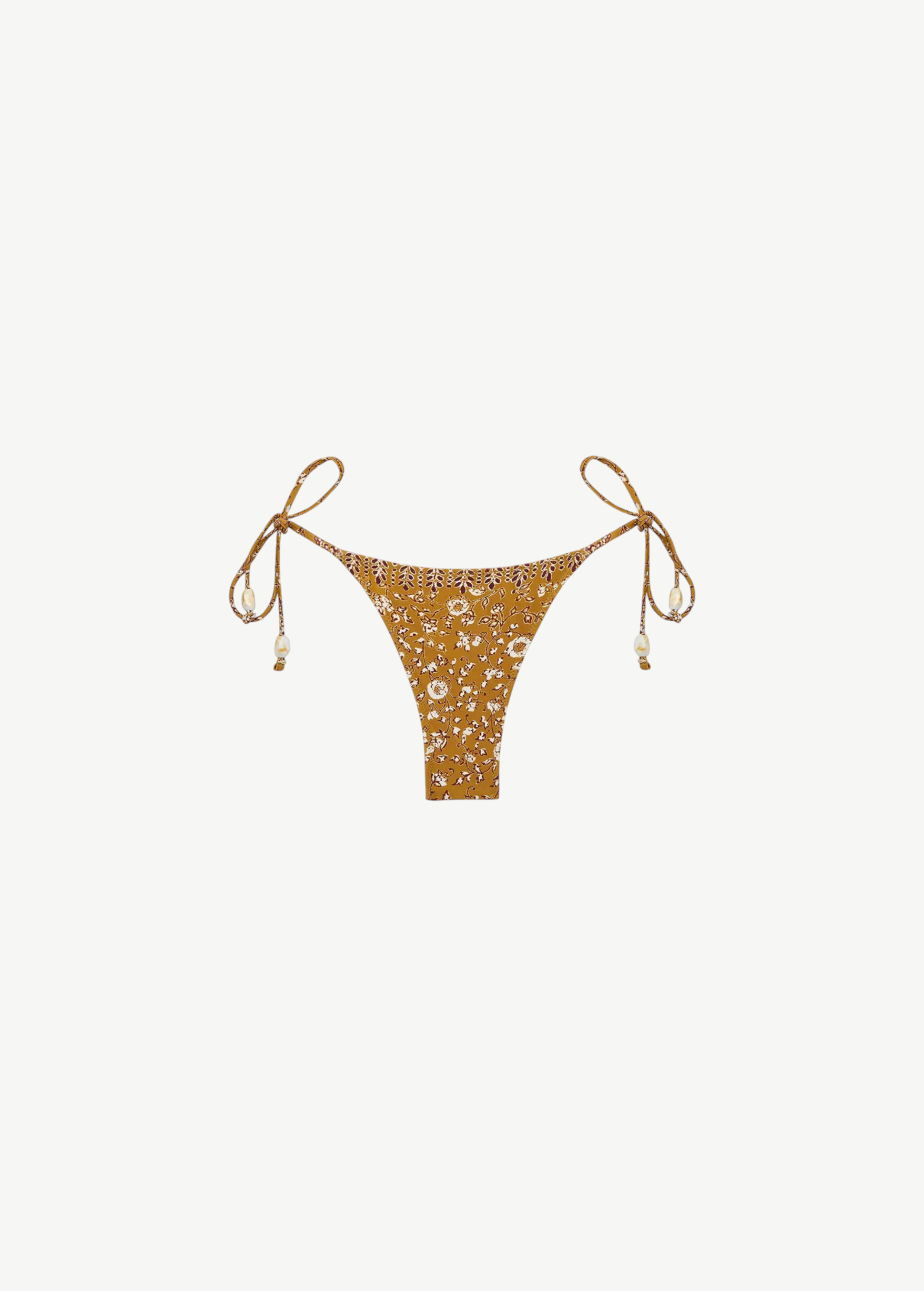 Praia Bottom: A gold beaded bikini bottom featuring a delicate white floral print, thin adjustable side ties embellished with beads, and a high-cut silhouette, made from recycled nylon swimwear material and showcased on a plain white background.