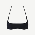 The Hamaca Top is a plain black bikini top with thin adjustable straps, crafted from sustainable compression fabric and displayed against a white background.