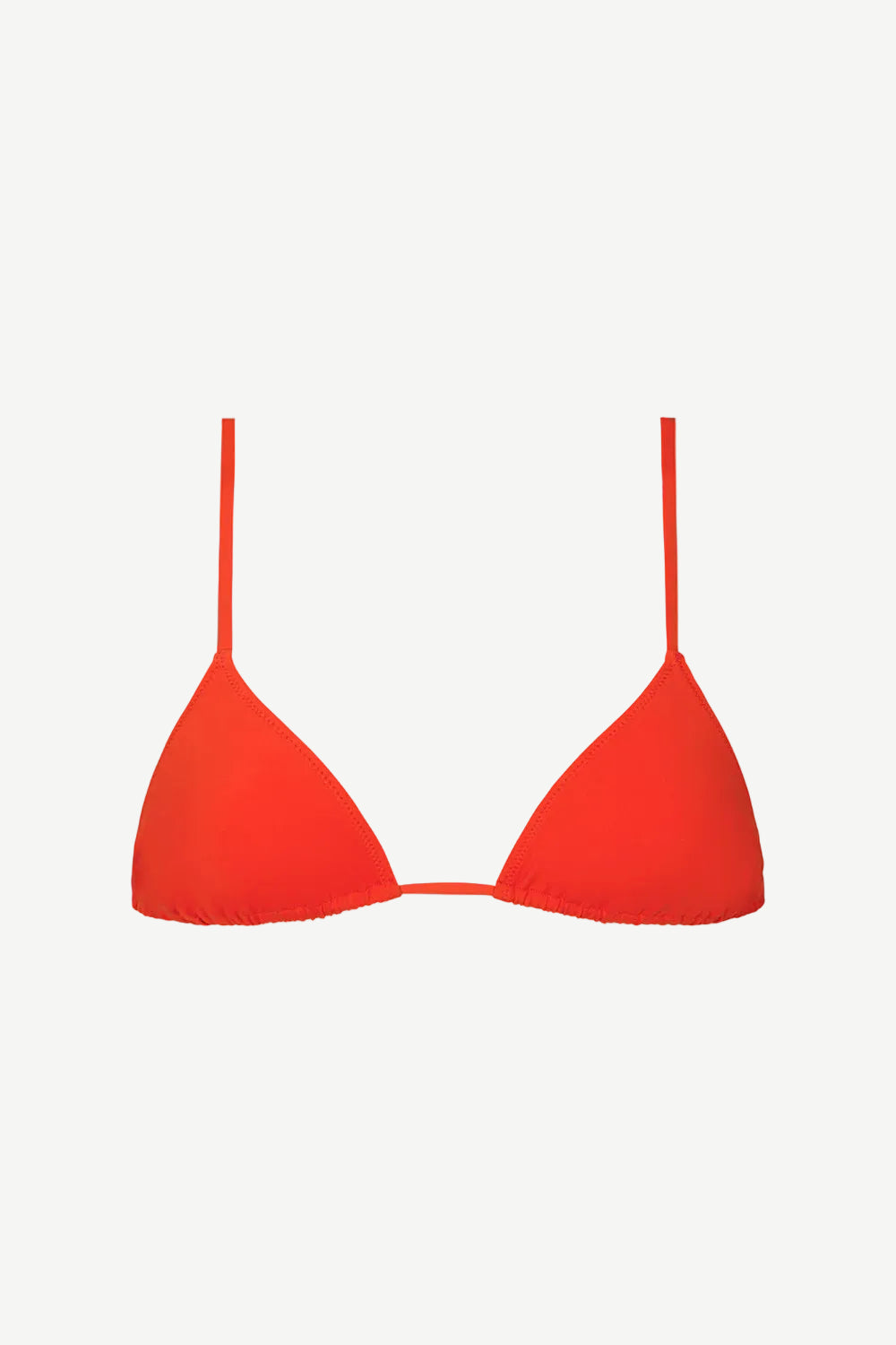 The Equator Top, a bright red triangle bikini top with thin straps, crafted from soft compression fabric for a comfortable and supportive fit, is shown against a plain white background.