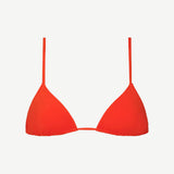 The Equator Top, a bright red triangle bikini top with thin straps, crafted from soft compression fabric for a comfortable and supportive fit, is shown against a plain white background.