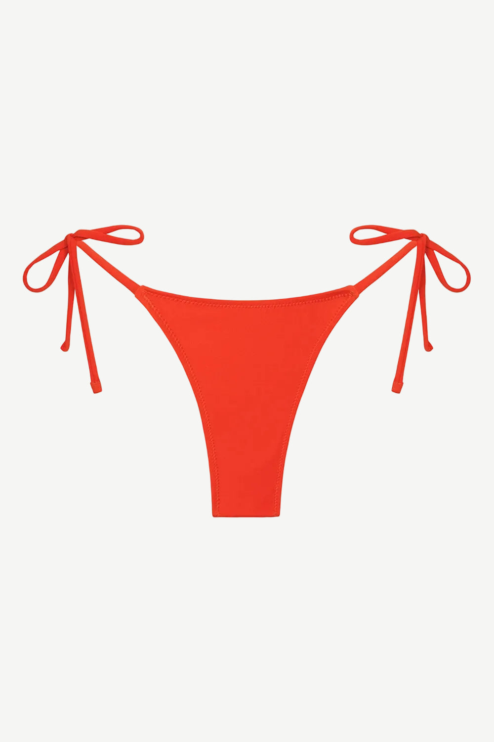 Praia Bottom in bright red, featuring a tie-side design with minimal back coverage, crafted from compression fabric and displayed against a plain white background.