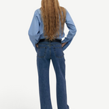 KABE SHOP INC Everyday Jeans in blue denim with a relaxed fit worn by a woman with long hair from the back view