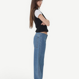 KABE SHOP INC Sport Jean in relaxed blue denim worn by a model in profile with a black vest and white t-shirt