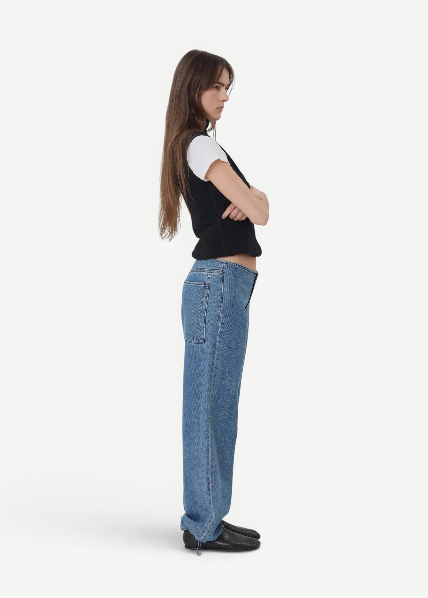 KABE SHOP INC Sport Jean in relaxed blue denim worn by a model in profile with a black vest and white t-shirt