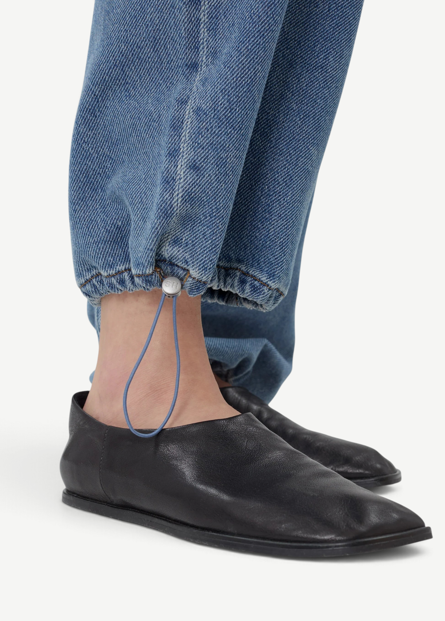 KABE SHOP INC Sport Jean in blue denim featuring a relaxed fit with an adjustable drawstring toggle at the ankle.