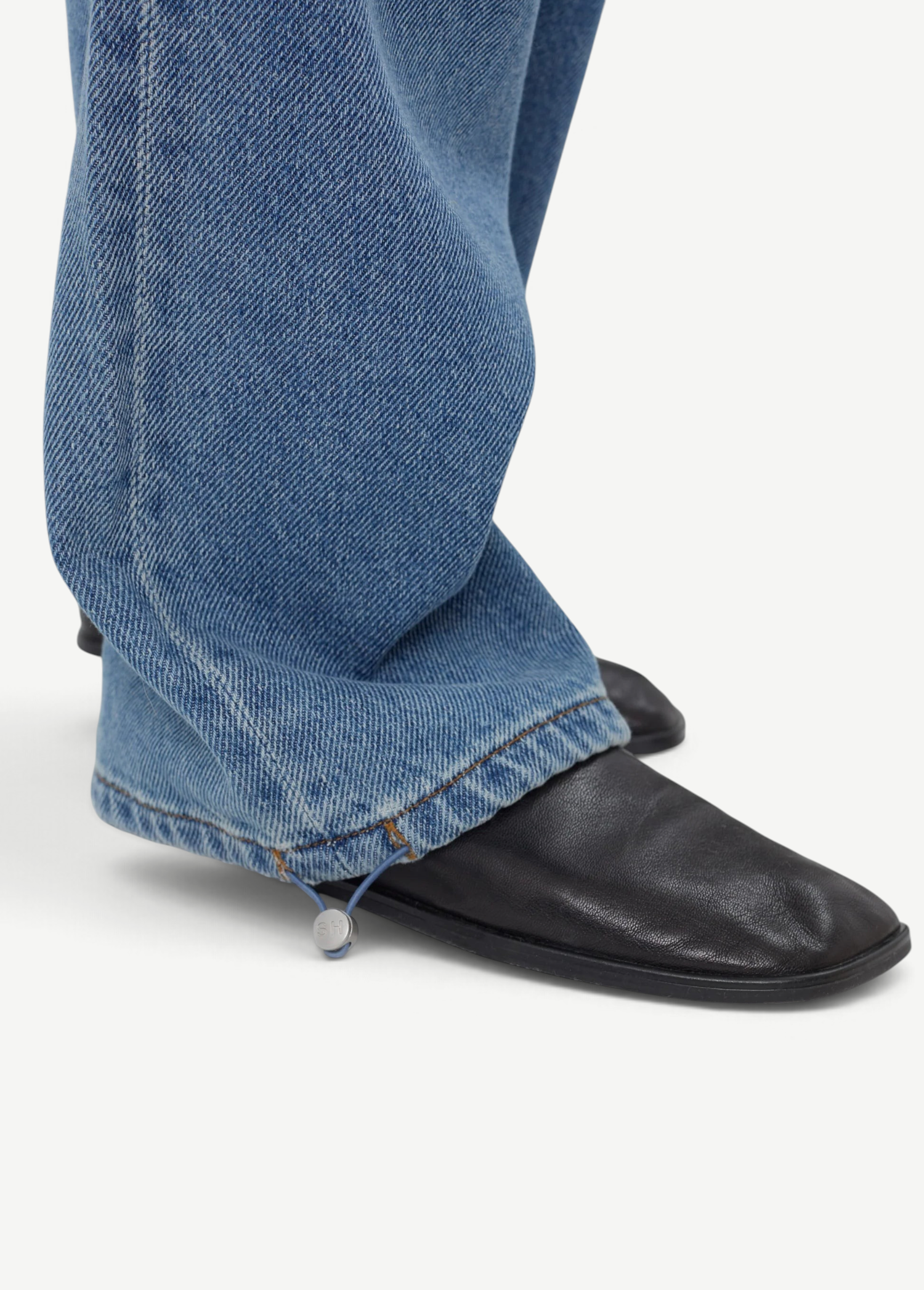 KABE SHOP INC Sport Jean in blue denim featuring a relaxed fit and an adjustable drawstring hem detail.