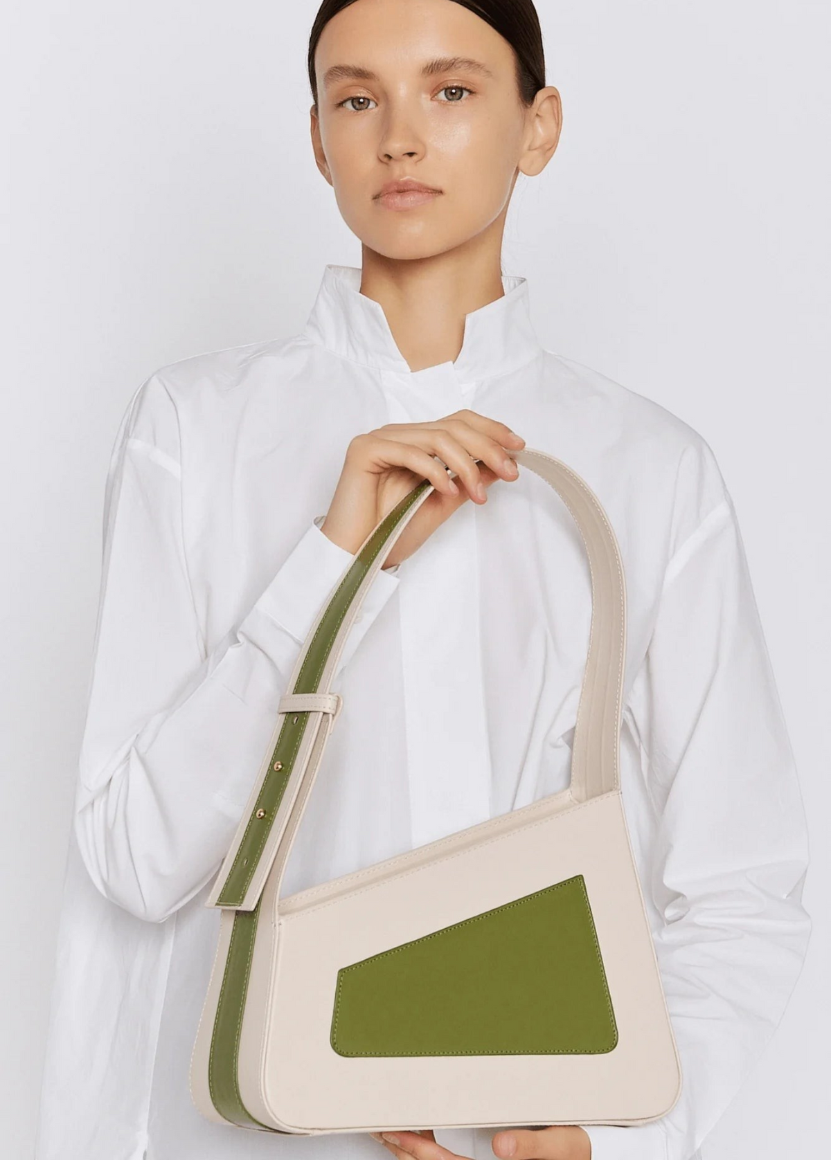 KABE SHOP INC Albert framed handbag in cream and olive green calfskin leather with an asymmetric angled silhouette.