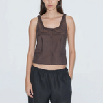 Model wearing KABE SHOP INC Deiji Studios brown cotton poplin tank top with frill detailing and button-through front.
