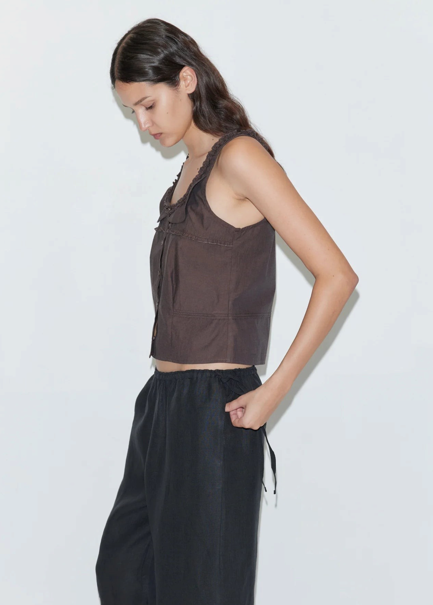 KABE SHOP INC Deiji Studios brown cotton poplin tank top with frill detailing and pintuck accents on a model