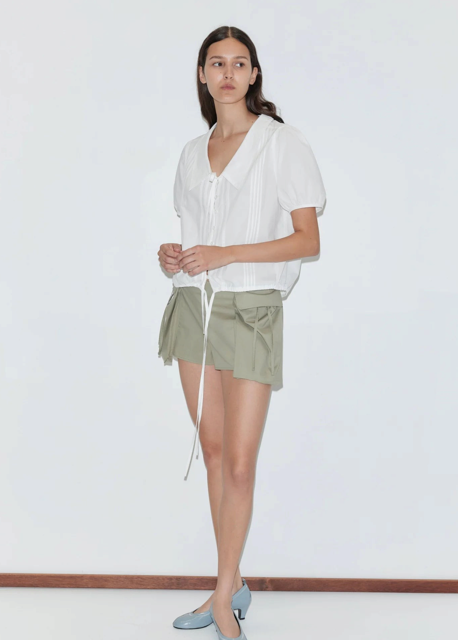 KABE SHOP INC Deiji Studios white cotton poplin top with collared V-neck, pintuck details, and adjustable hem