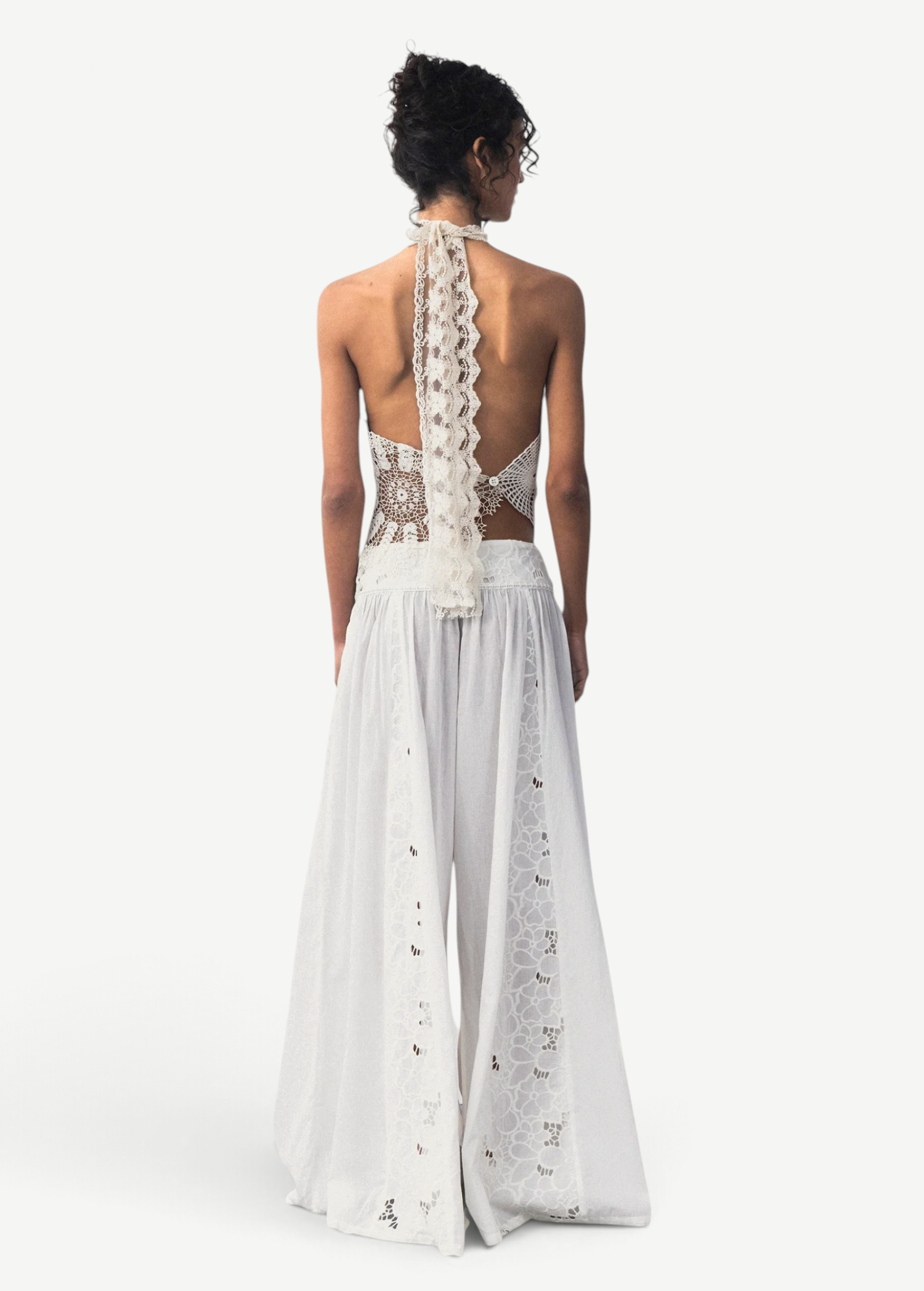 KABE SHOP INC Menorca trousers in white cotton with intricate lace detailing, shown from the back on a model.