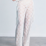 KABE SHOP INC white lace trousers with a strappy handkerchief waistband and a fitted silhouette on a model