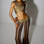 Model wearing KABE SHOP INC Cher Set featuring a metallic gold and bronze woven crop top and matching flared trousers.