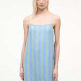 The Laura Mini Dress is a sleeveless mini dress for warm-weather dressing featuring thin shoulder straps and vertical blue and green stripes.