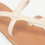 KABE SHOP INC Armos sandals featuring cream leather straps and a tan footbed in a classic minimalist design.