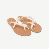 KABE SHOP INC Armos sandals featuring off-white leather straps and a tan flat sole in a classic thong design.