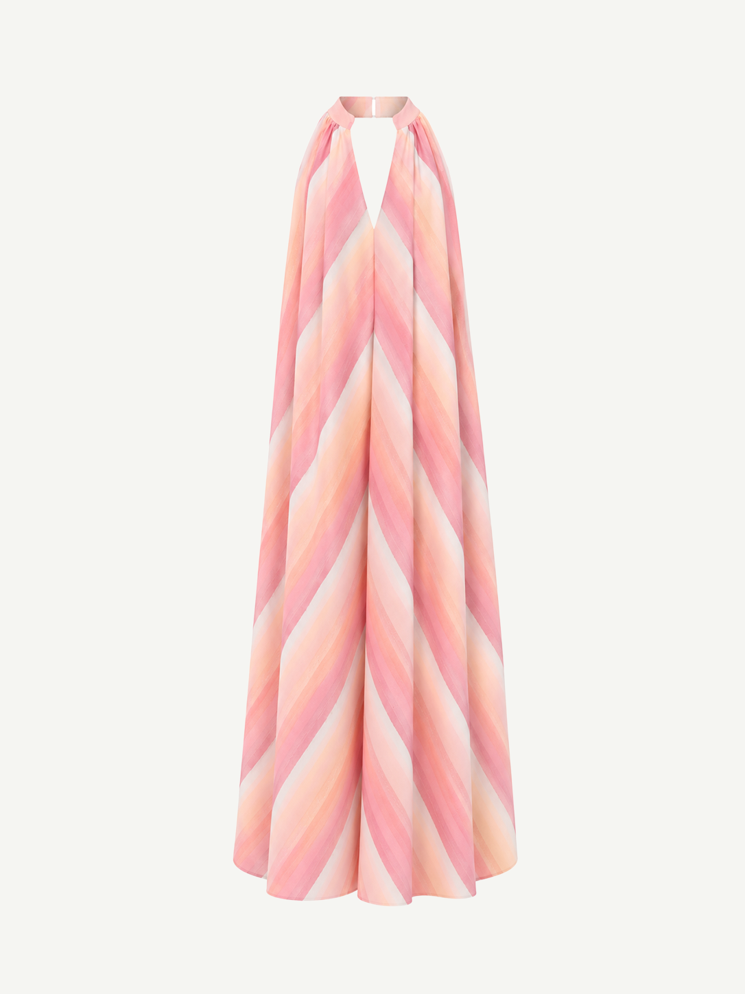The Halter Dress V-Neck is a sleeveless maxi dress with a halter neckline, crafted from handwoven cotton and adorned with pink, peach, and white diagonal stripes that capture the vibrant essence of Marrakech—displayed on a white background.