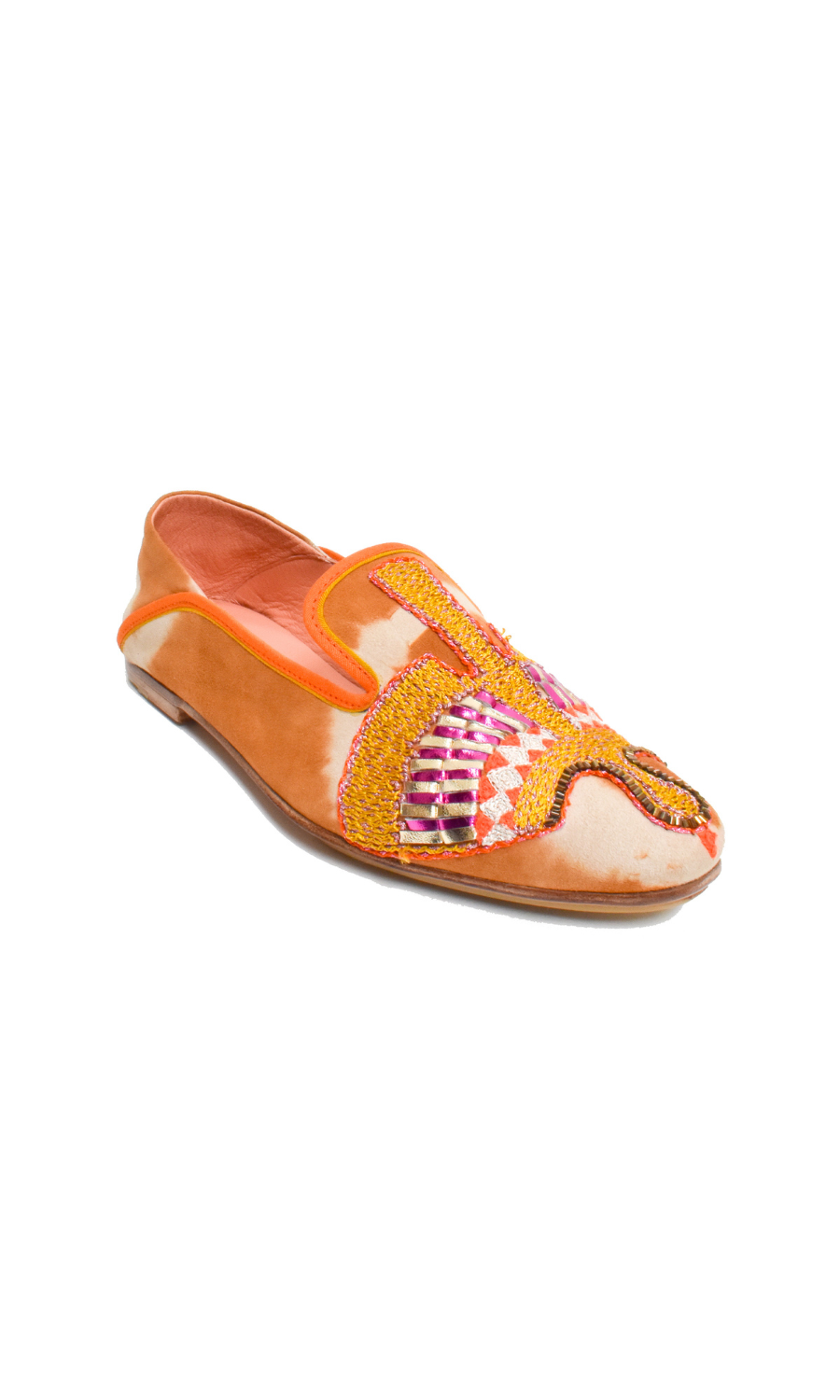 The Anzu Moccasin is an orange and tan slip-on featuring pink, yellow, and gold hand-embroidered patterns on the upper. With a flat sole and rounded toe, this sustainable shoe is inspired by the classic moccasin and is displayed on a white background.