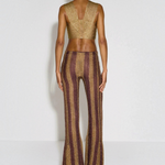 Back view of KABE SHOP INC Cher Set featuring a gold metallic crop top and striped wide-leg trousers on a model.