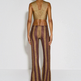 Back view of KABE SHOP INC Cher Set featuring a gold metallic crop top and striped wide-leg trousers on a model.