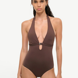 A woman wearing a deep brown La Jolla Swimwear La Jolla One Piece, a halter-style swimsuit featuring a silver ring detail at the center cutout.