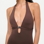 A brown La Jolla Swimwear one-piece swimsuit with a deep halter neckline and a silver crescent-shaped hardware accent at the center.