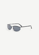 KABE SHOP INC Charlotte sunglasses with a sleek black metal oval frame and dark blue lenses