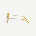 KABE SHOP INC Amelia pilot sunglasses with a gold frame and vibrant yellow tinted lenses, side profile view.