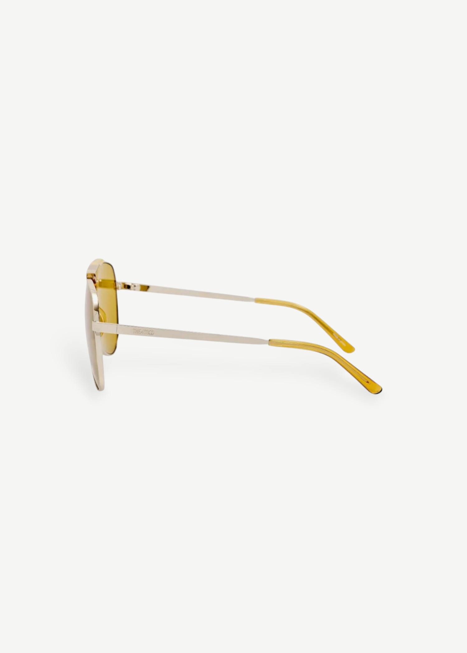KABE SHOP INC Amelia pilot sunglasses with a gold frame and vibrant yellow tinted lenses, side profile view.