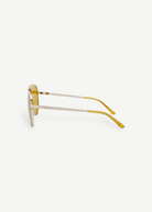 KABE SHOP INC Amelia pilot sunglasses with a gold frame and vibrant yellow tinted lenses, side profile view.