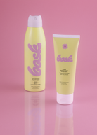 KABE SHOP INC SPF 50 sunscreen lotion and continuous spray mist in yellow packaging on a pink background