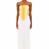 Wearing The Triangle Top—a strapless, yellow-to-white gradient piece crafted with sustainable Marrakech fashion techniques—and high-waisted, wide-leg white pants, the person stands facing forward against a plain white background.